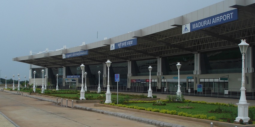 The exterior view of Madurai Airport showcases the terminal building and surrounding landscape.