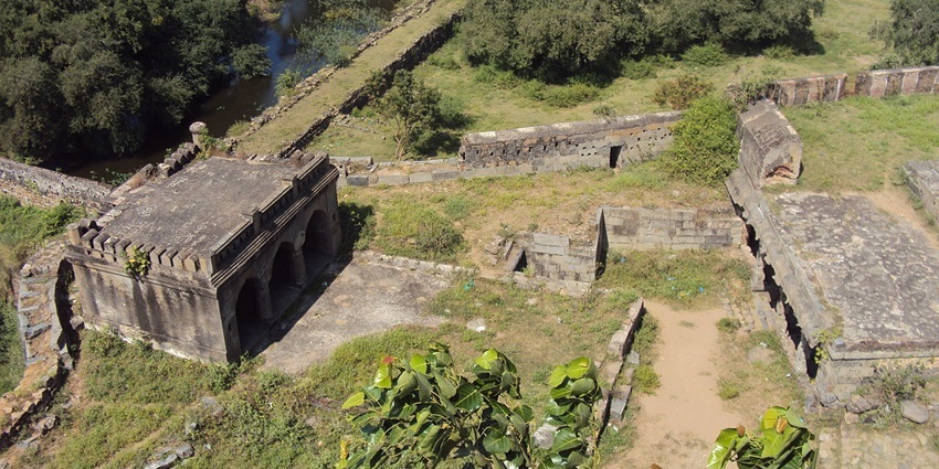 Aerial view of the tall walls of the surrounded by verdant landscapes
