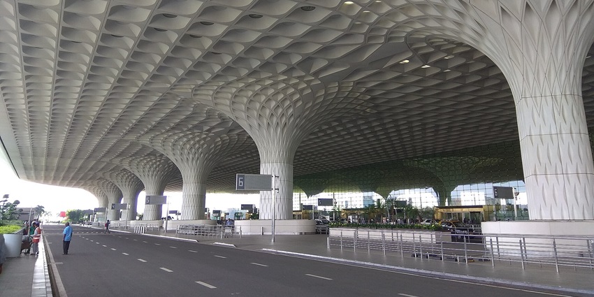 Chhatrapati Shivaji Maharaj International Airport Mumbai, with its iconic white roof structure and rows of pillars.