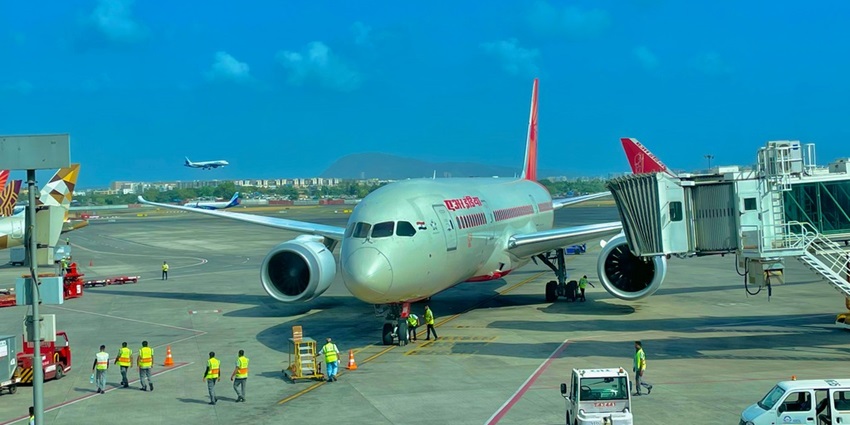 A picture of an aeroplane at an airport in Mumbai, about to take off.