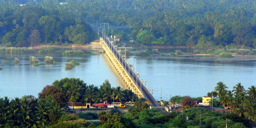 Expansive Kaveri Rail Bridge in Trichy over the river and surrounded by greenery