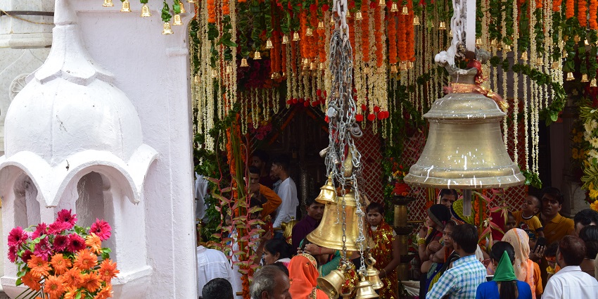 A picture showing hundreds of devotees praying and seeking blessings at a temple in Maharashtra