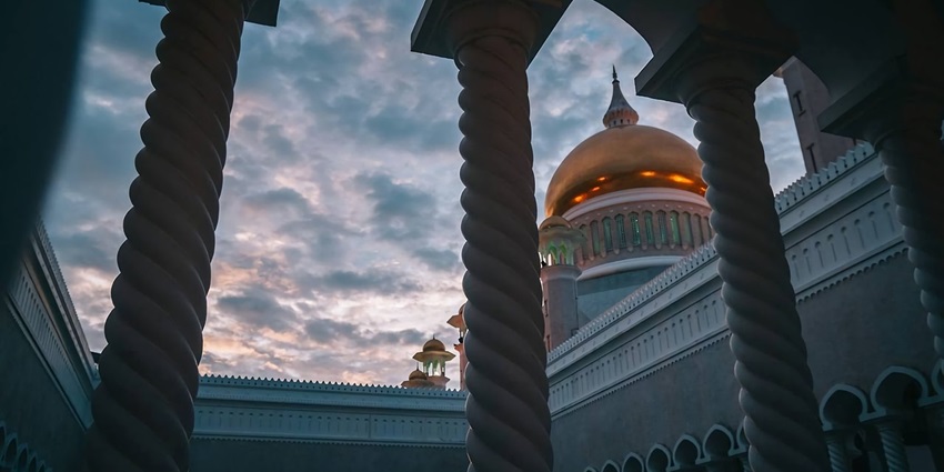 A placid view of temple pillars and columns showcasing intricate carvings and traditional design