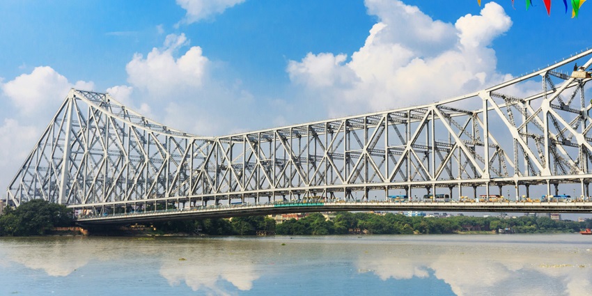 Howrah Bridge, one of the places to visit in Kolkata with family, is one of the landmarks.