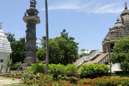 Jagannath Temple with the intricate Aruna Stambha pillar and vibrant green architecture