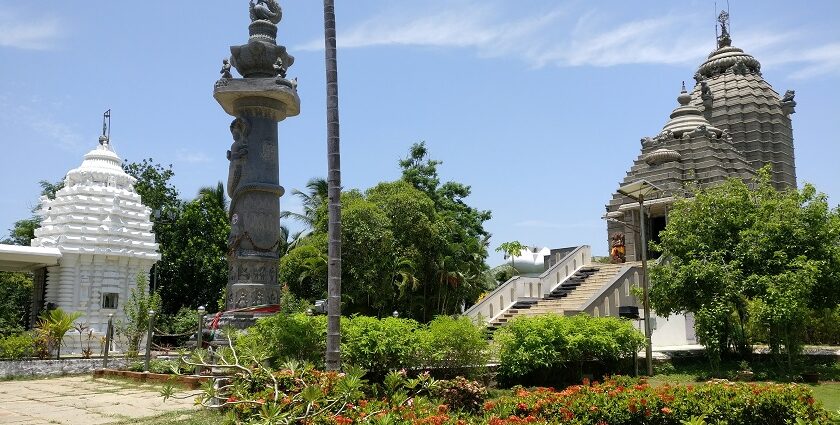 Jagannath Temple with the intricate Aruna Stambha pillar and vibrant green architecture