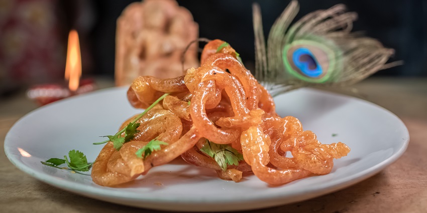 An image of Jalebi is a sweet dessert is often eaten for breakfast with sweet dahi (curd).