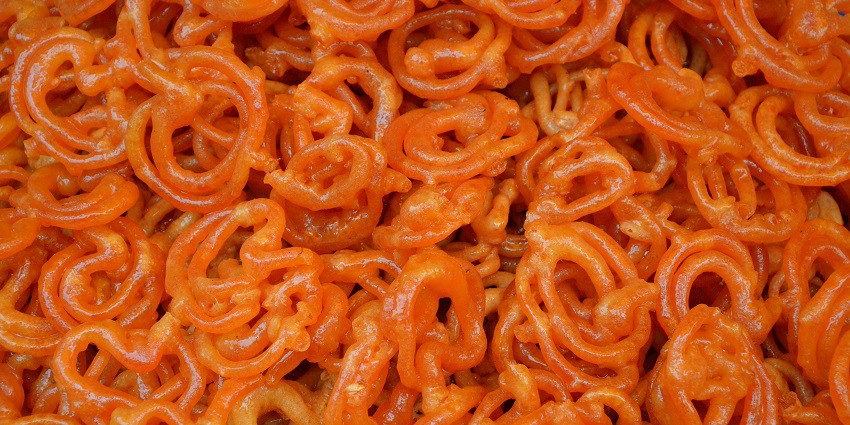 Crispy jalebis soaked in syrup are a must-try among the best foods in Meerut.