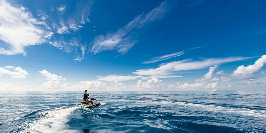 An exciting picture capturing riders enjoying jet skiing among popular water sports in Kihim.