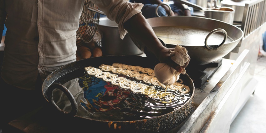 The famous food in Kanyakumari is Jilebi, a spiral-shaped dessert soaked in sugar syrup.