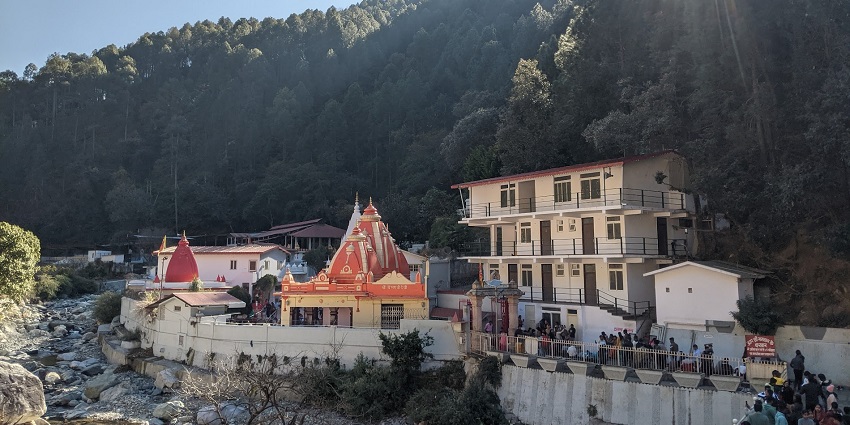 A view of a spiritual ashram nestled in nature, famous for a peaceful ambience.