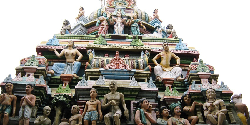 A top of the shrine is showcased which has various carved sculptures in vibrant colour