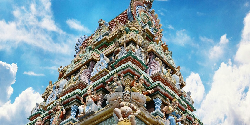 Kamakshi Amman Temple with seated goddess idol, Sri Yantra, and towering gopuram in Dravidian architecture style, one of the best temples in Porur Chennai.