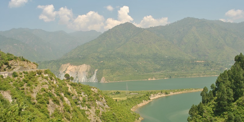 An image showing the picturesque landscape around Tehri Dam in Kanatal, Uttarakhand.