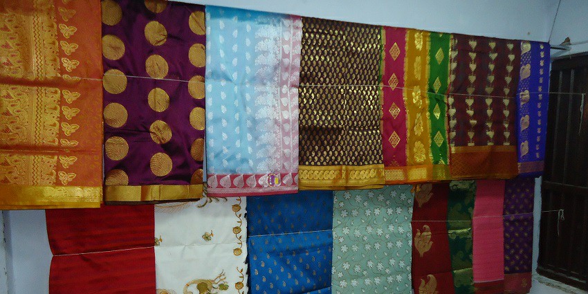 Beautiful and popular Kanchipuram silk sarees hanging at a shop in Kanchipuram, Tamil Nadu.