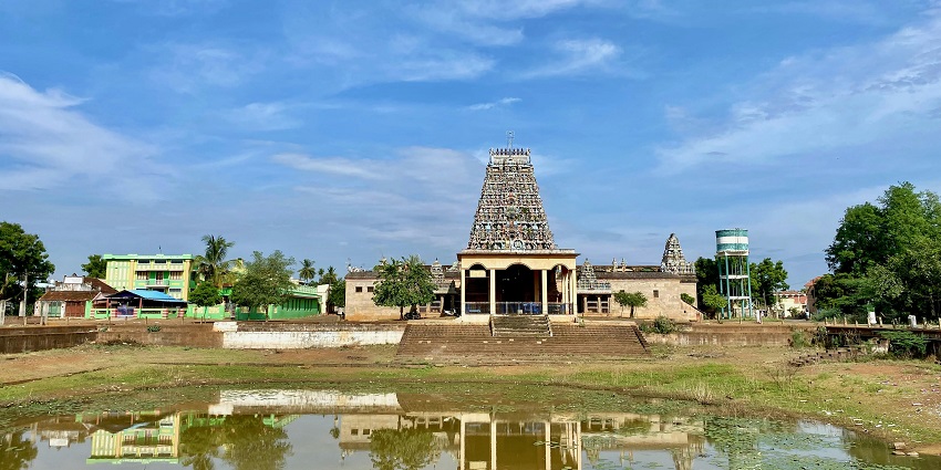 Historic Kannadi Perumal Temple surrounded by a pleasant village setting and greenery.
