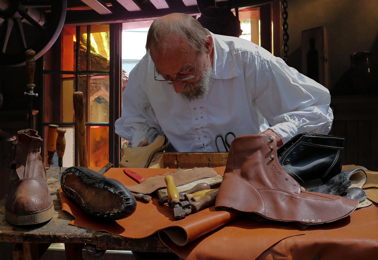 A picture of a skilled artisan making leather shoes in his workshop in Uttar Pradesh