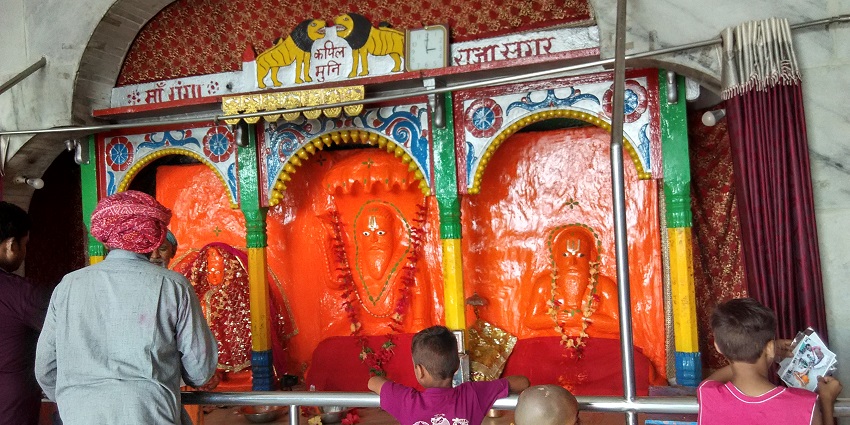 A glimpse of devotees are seen worshipping the shrine of Kapil Muni at the temple.