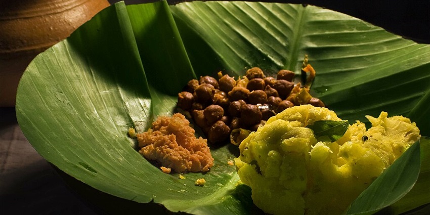 Starchy tapioca dish, often served with spicy sides on a green banana leaf.