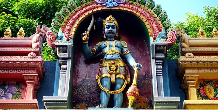 Kuruppuswamy with detailed stone carvings, statues, and traditional architecture.