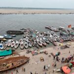 A picture of Kashi with its serene ghats and ancient temples in the background.