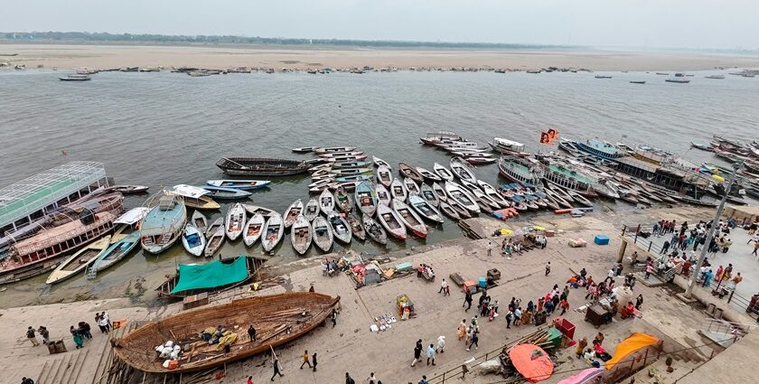 A picture of Kashi with its serene ghats and ancient temples in the background.