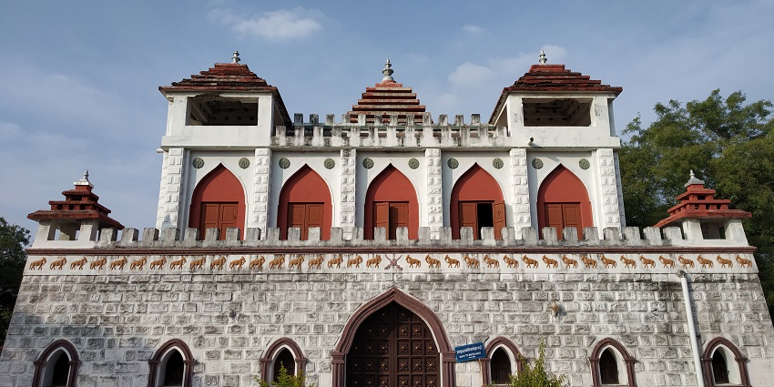 Panchalankurichi Memorial Fort with white stone walls and trees surrounding the area