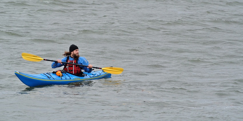 Tehri Lake water sports include paddling activity ideal for exploring serene water bodies.