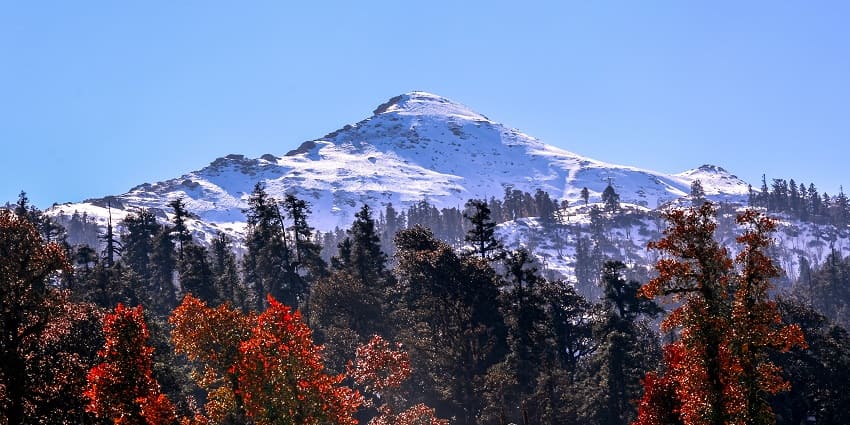 Winter trek with stunning snow-covered landscapes and mountain views.