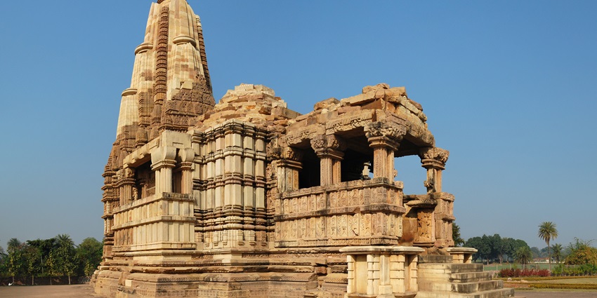 Stone carvings on Dulhadeo Temple at Khajuraho with intricate sculptural details.