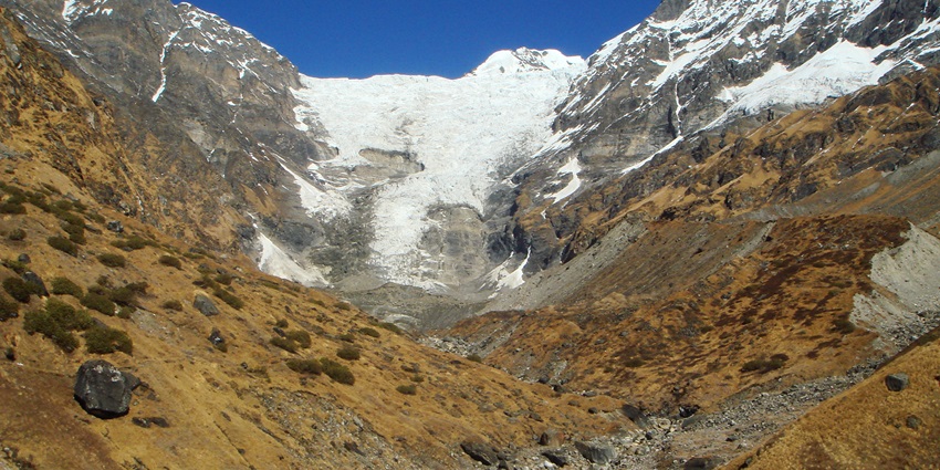 A breathtaking view of the Khatling Glacier featuring majestic snow-capped peaks.