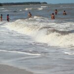 A captivating image showcasing thrilling Kihim water sports against a beautiful beach backdrop.