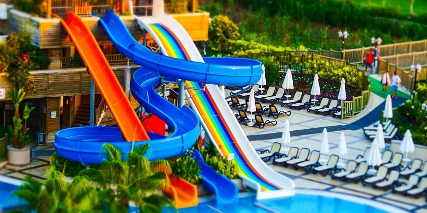 Colourful plastic slides at Kishkinta Water Park, a popular water park in Chennai.