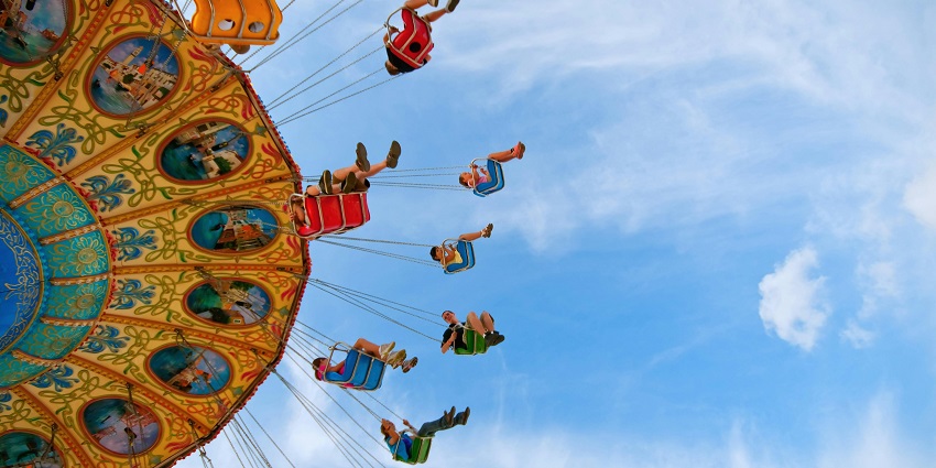 An image of people enjoying a carousel ride - one of the amusement parks in Tamil Nadu.