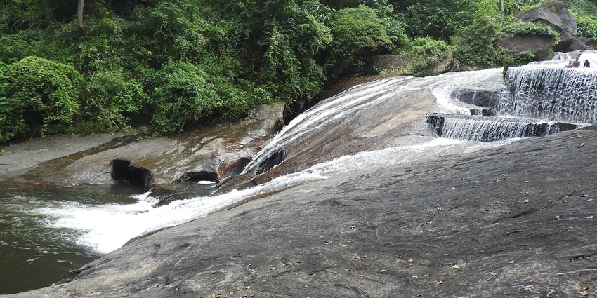 Refreshing Kovai Kutralam Waterfalls, a popular tourist attraction near Isha Temple.