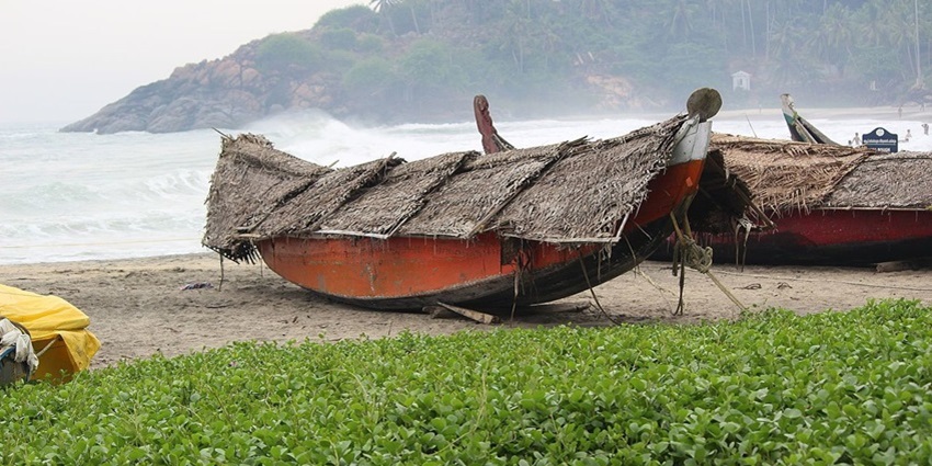 Boats parked on the shore of the Kovalam Beach, situated near the Ratha Temples.