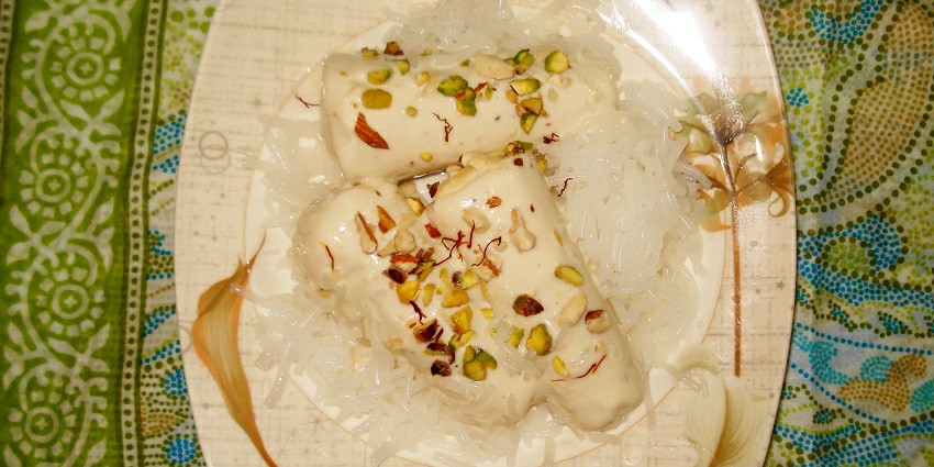 A picture of a famous dessert made with milk and dry fruits served at a restaurant in Meerut