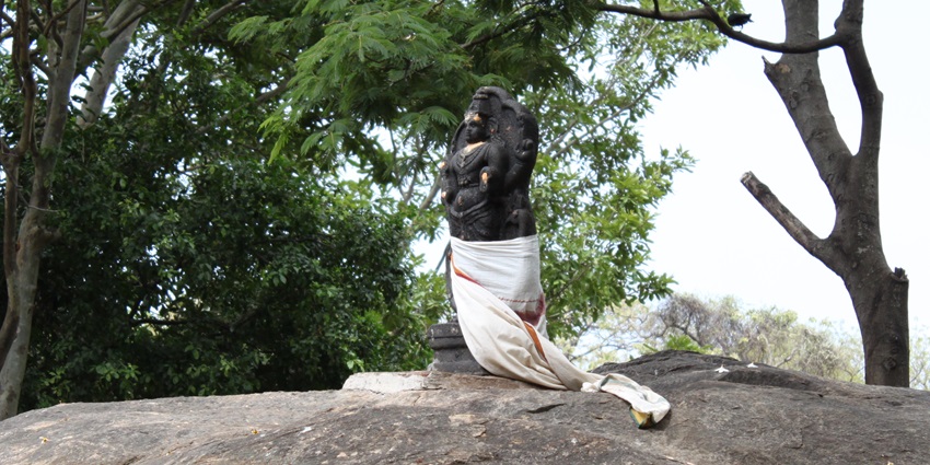 An idol of Lord Murugan at the Kumbakkarai Falls located near the Kuchanur Temple