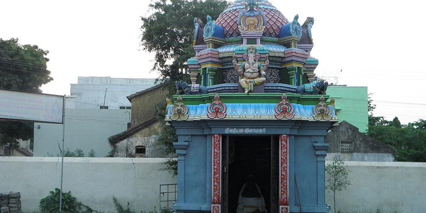 Small temple entrance with sculpted motifs, blending tradition and simplicity.
