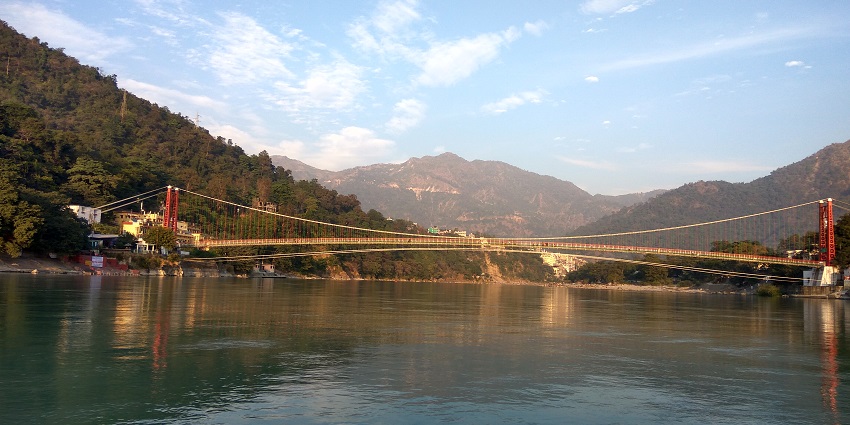 Iconic suspension bridge offering scenic views and spiritual significance of Rishikesh.