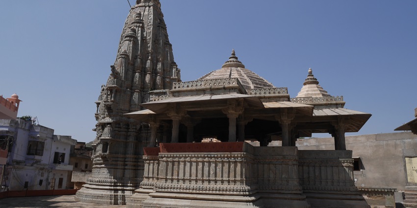 Front view of Sri Laxmi Narayan Temple with detailed carvings and arched entrance.
