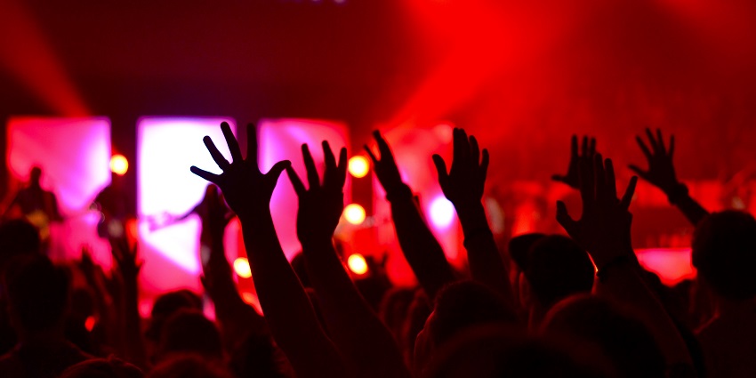 An image of a bustling nightclub on Legian Street featuring energetic party scenes.