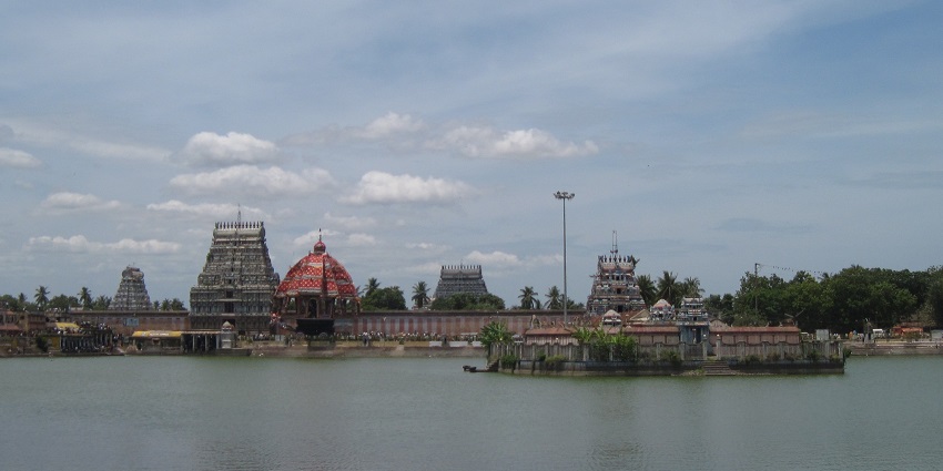 Distant view of the temple with a serene lake in the front