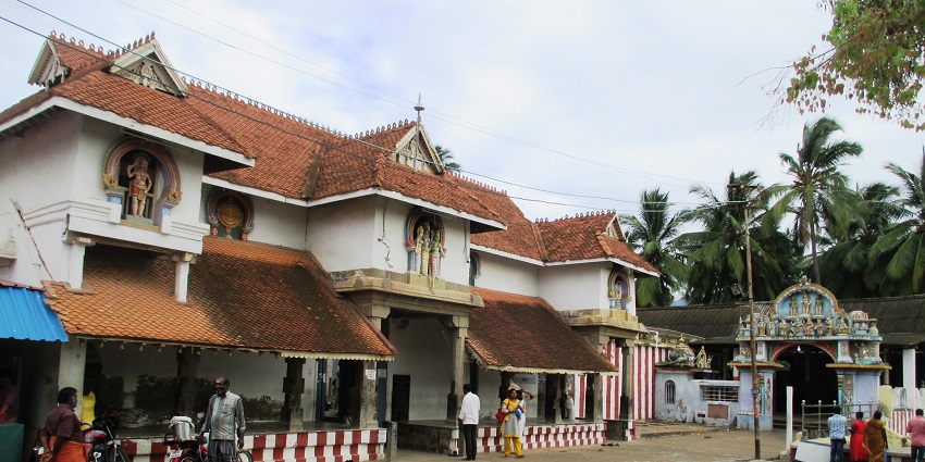 A distant outside view of Nagercoil Temple around which many people are present.