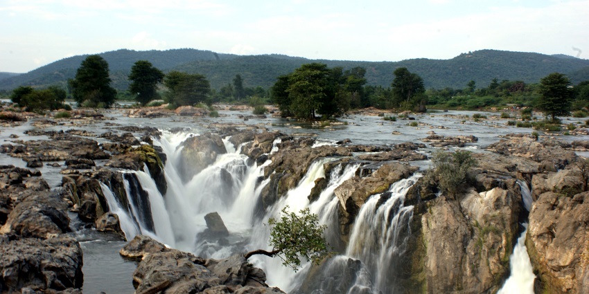 A view of Hogenakkal Waterfalls, the silver water beating down the rocks