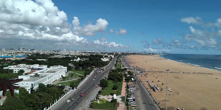 Aerial view of Chennai city with buildings and roads stretching into the distance.