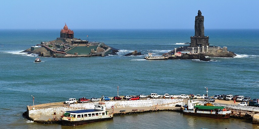 View of the Kanyakumari coastline with the ocean and rocky formations.