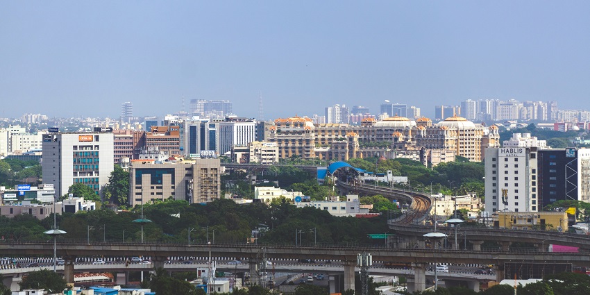 Chennai city skyline viewed from St. Thomas Mount, with high-rise buildings and greenery
