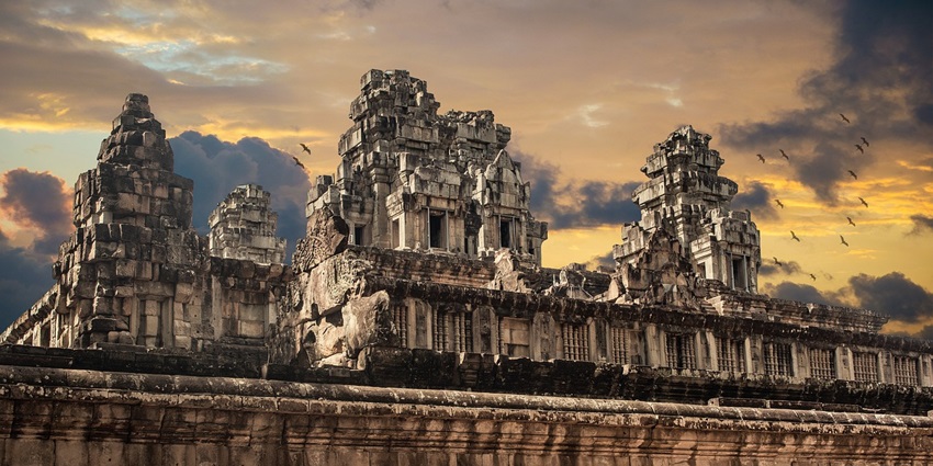 Stunning temple architecture under a sky filled with clouds, highlighting its intricate design