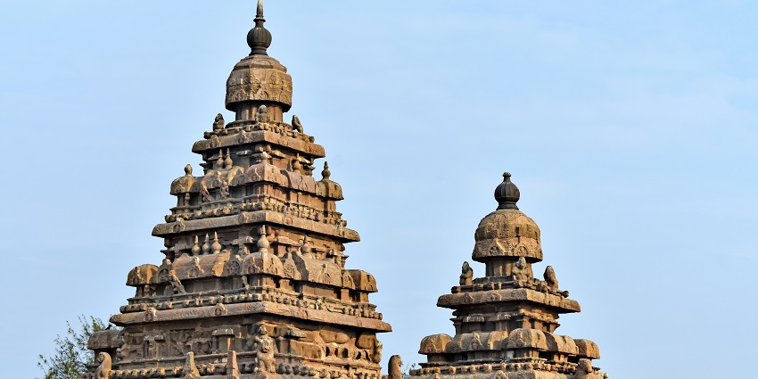 An image showing the beautifully engraved structure of The Mahabalipuram Temple.